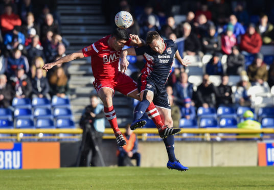 Ross County defender Andy Boyle (right) is on loan from Preston.