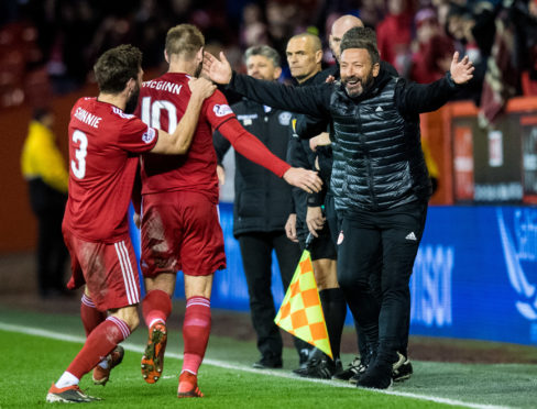 Aberdeen manager Derek McInnes celebrates with goalscorer Niall McGinn.