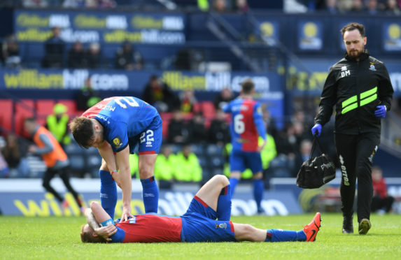 Carl Tremarco lays prone after catching a boot to the knee.