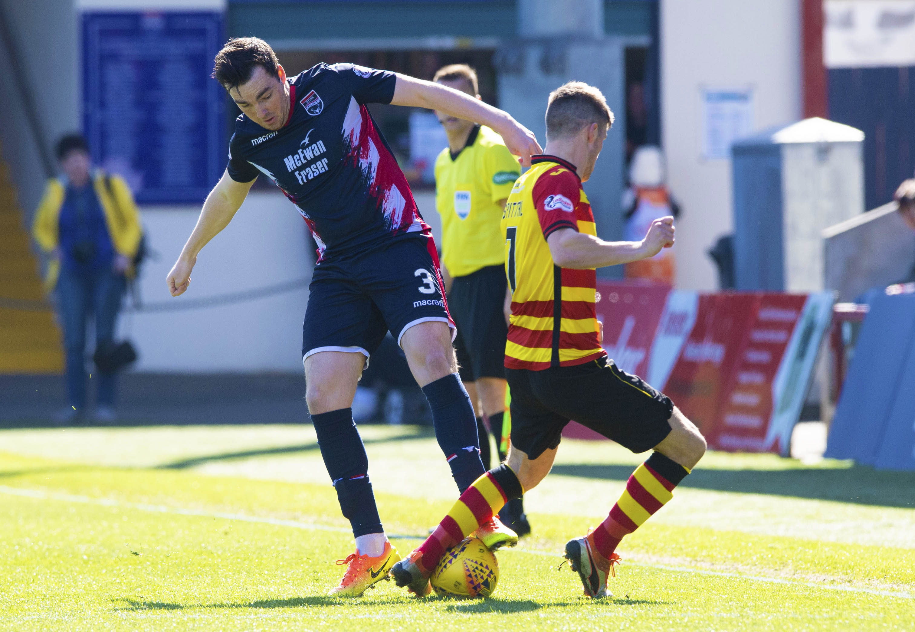 Ross County's Sean Kelly (L) competes with Partick Thistle's Blair Spittal, who has signed for County.