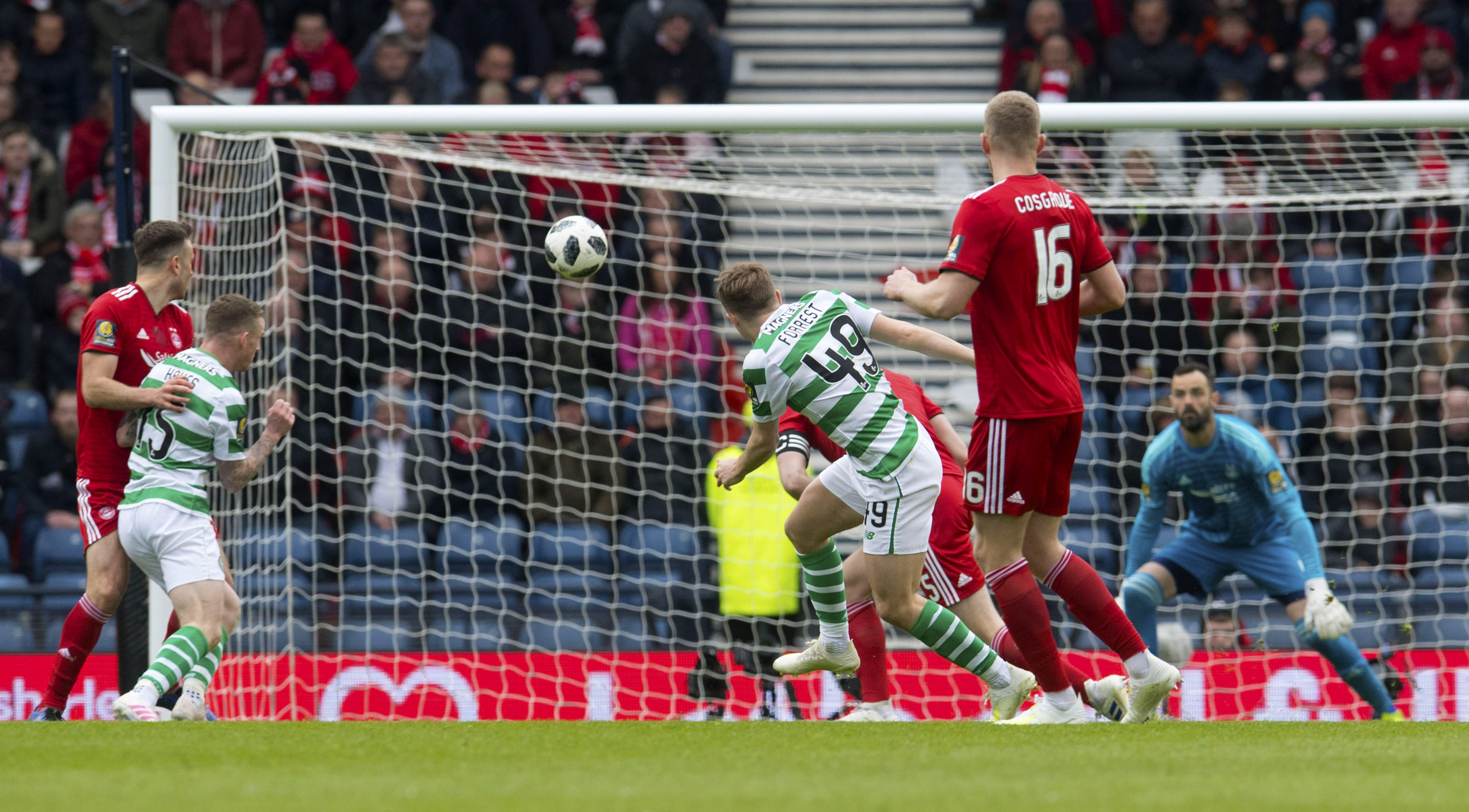 Celtic's James Forrest curls past Aberdeen goalkeeper Joe Lewis  to make it 1-0