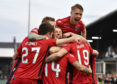 Brian Graham (19) is mobbed after second goal against Ayr.