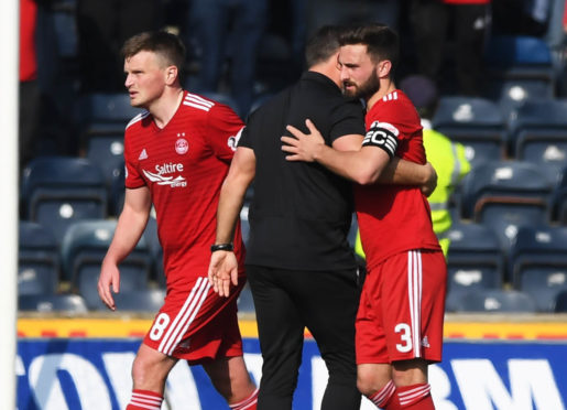 Aberdeen manager Derek McInnes celebrates with captain Graeme Shinnie (R) at full-time.