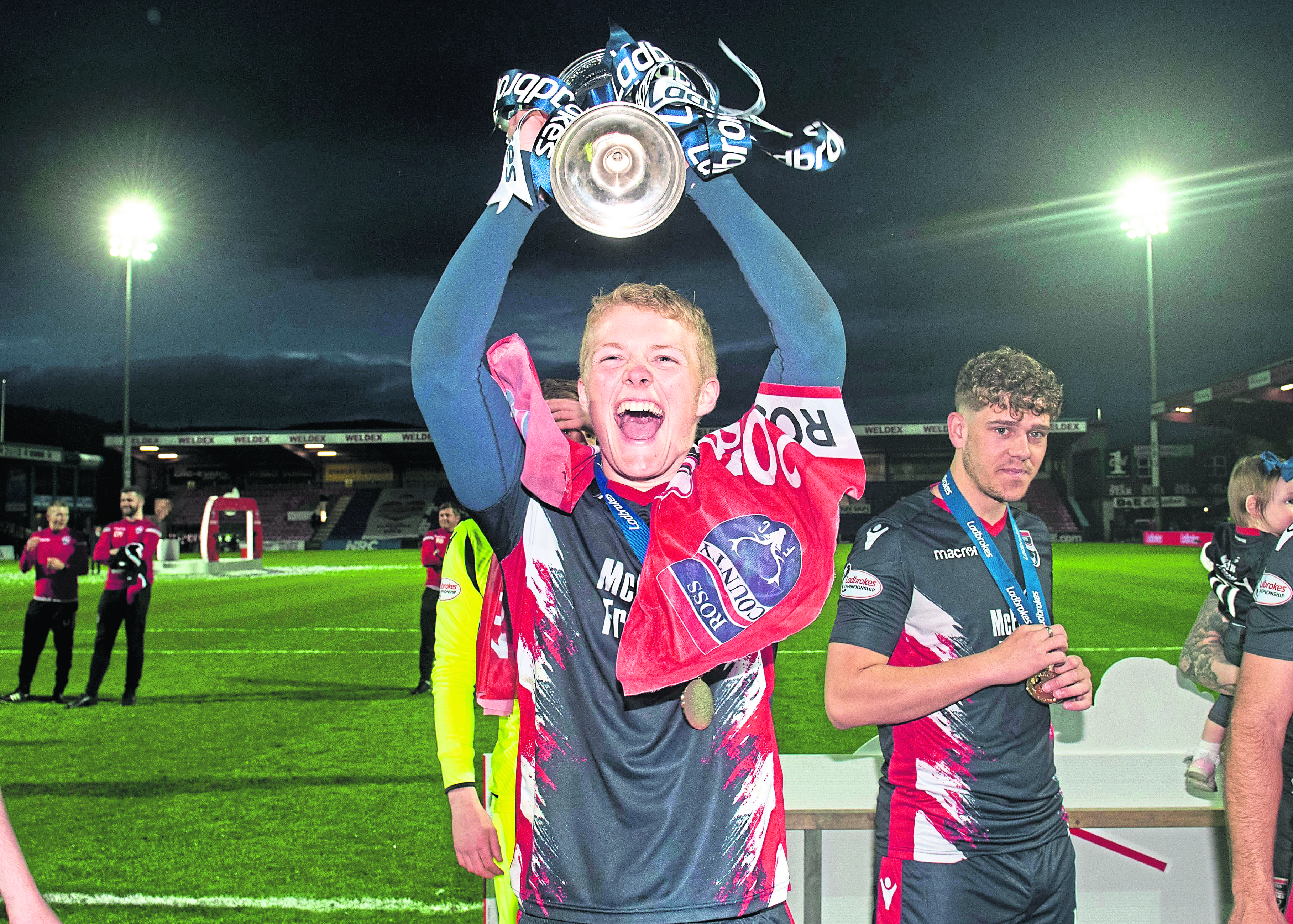 Ross Countys Tom Grivosti holds aloft the Ladbrokes Championship trophy.