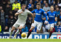 Aberdeen's Dominic Ball (L) in action with Rangers' Jon Flanagan
