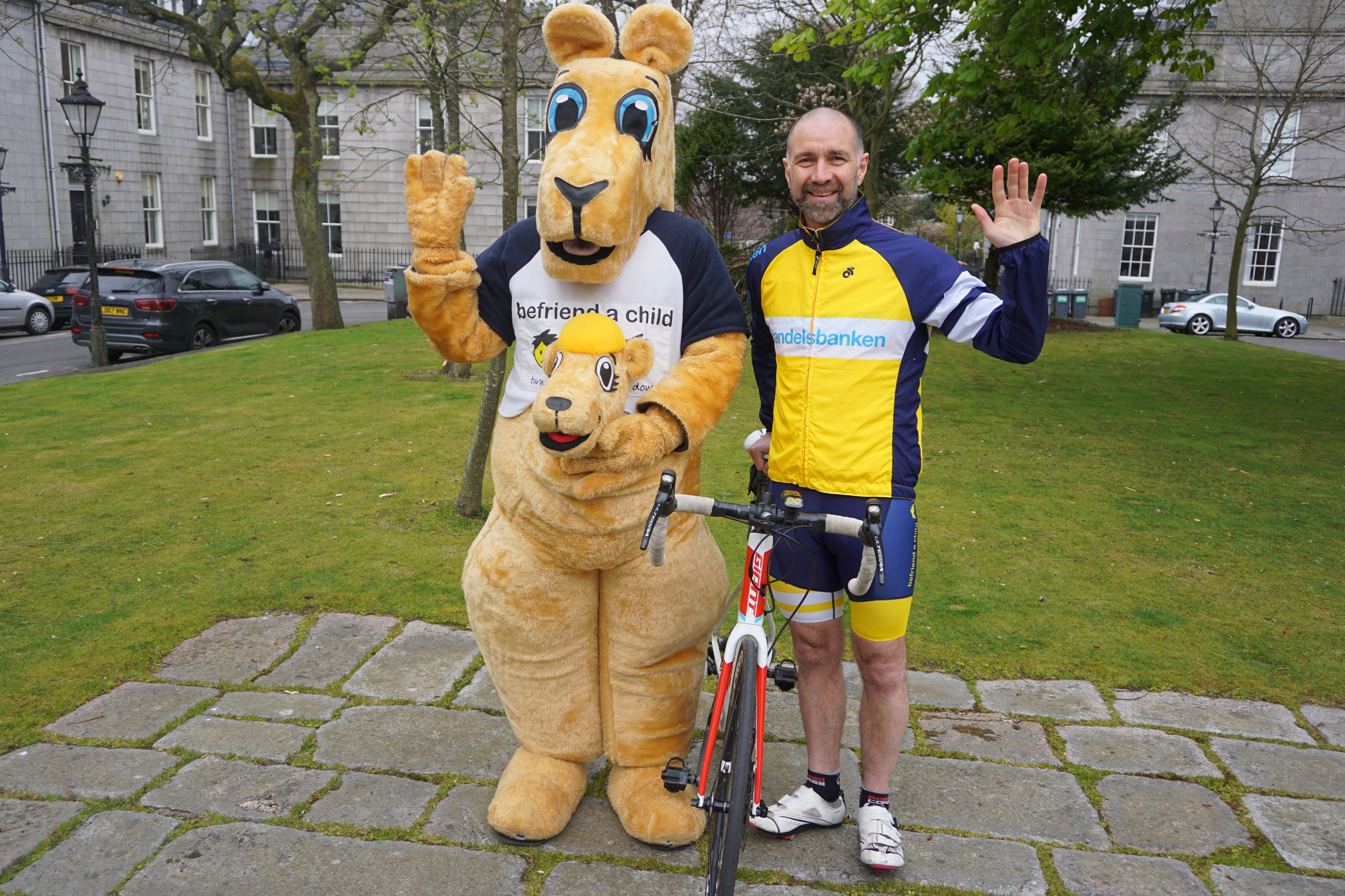 Steve Rae (right) with Kuddles the Befriend a Child mascot.