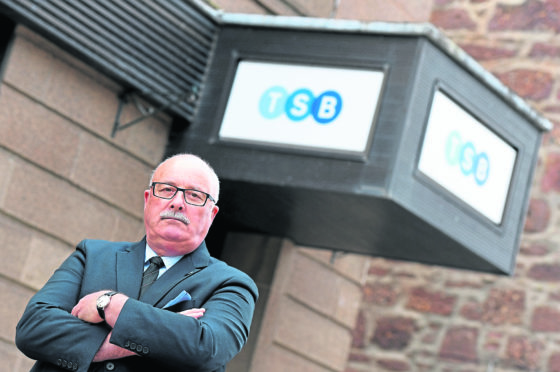 Councillor Alistair Forsyth at the TSB Bank, Main Street, Turriff, which is having its opening hours cut. Picture by Kami Thomson.