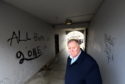 Councillor Bill Cormie at the lane between Richmond Street and Richmond Walk, for which he has received many complaints about the graffiti.     
Picture by Kami Thomson.