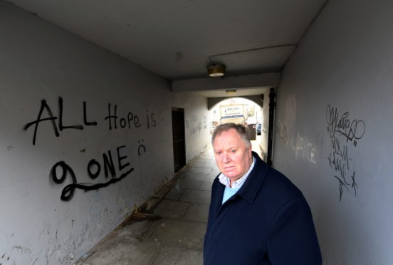 Councillor Bill Cormie at the lane between Richmond Street and Richmond Walk, for which he has received many complaints about the graffiti.     
Picture by Kami Thomson.