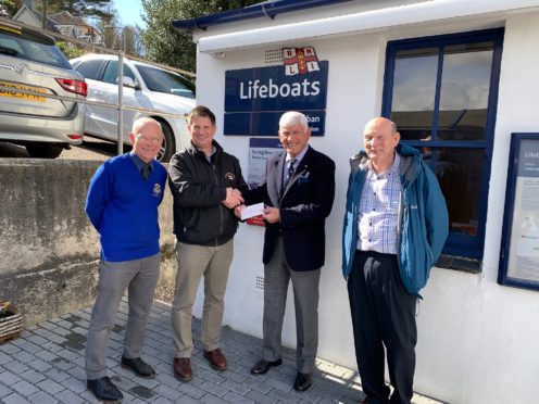 The Rotary Club of Oban president Iain MacIntyre presenting a cheque to Andrew Mead the treasurer of Oban RNLI.