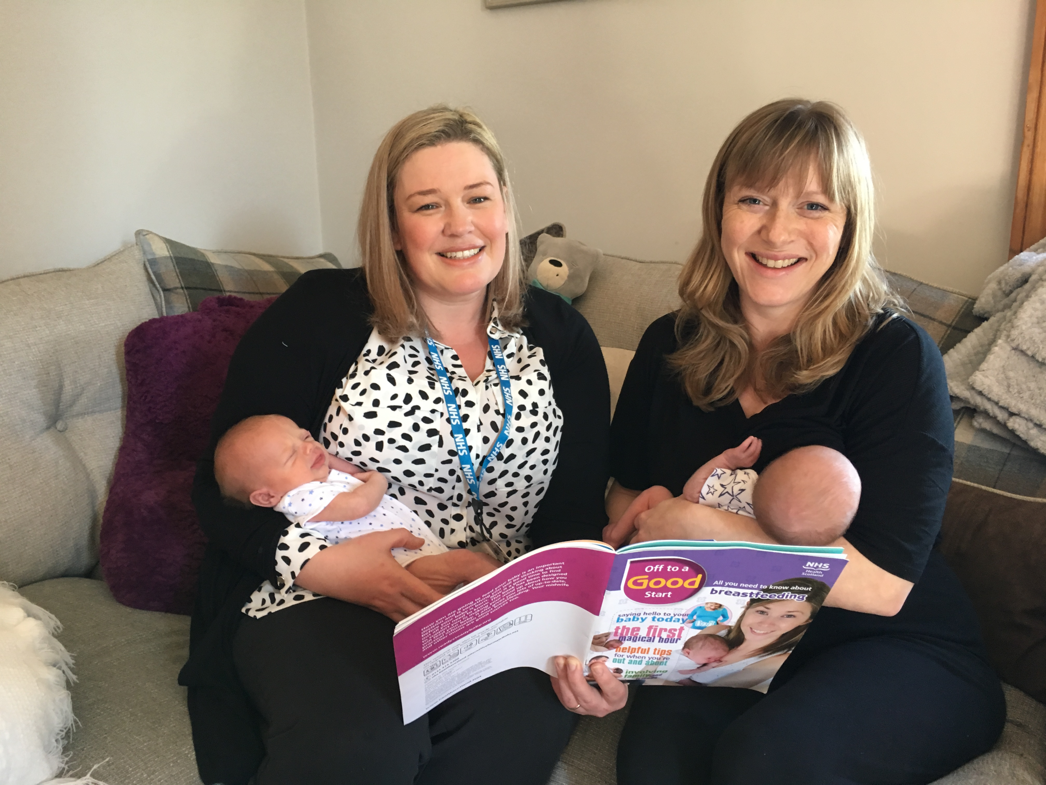 Trainee health visitor Annmarie Smith pictured on the left holding baby Eddie Gray and Michelle Leye (Mum) on the right breastfeeding his brother William Gray