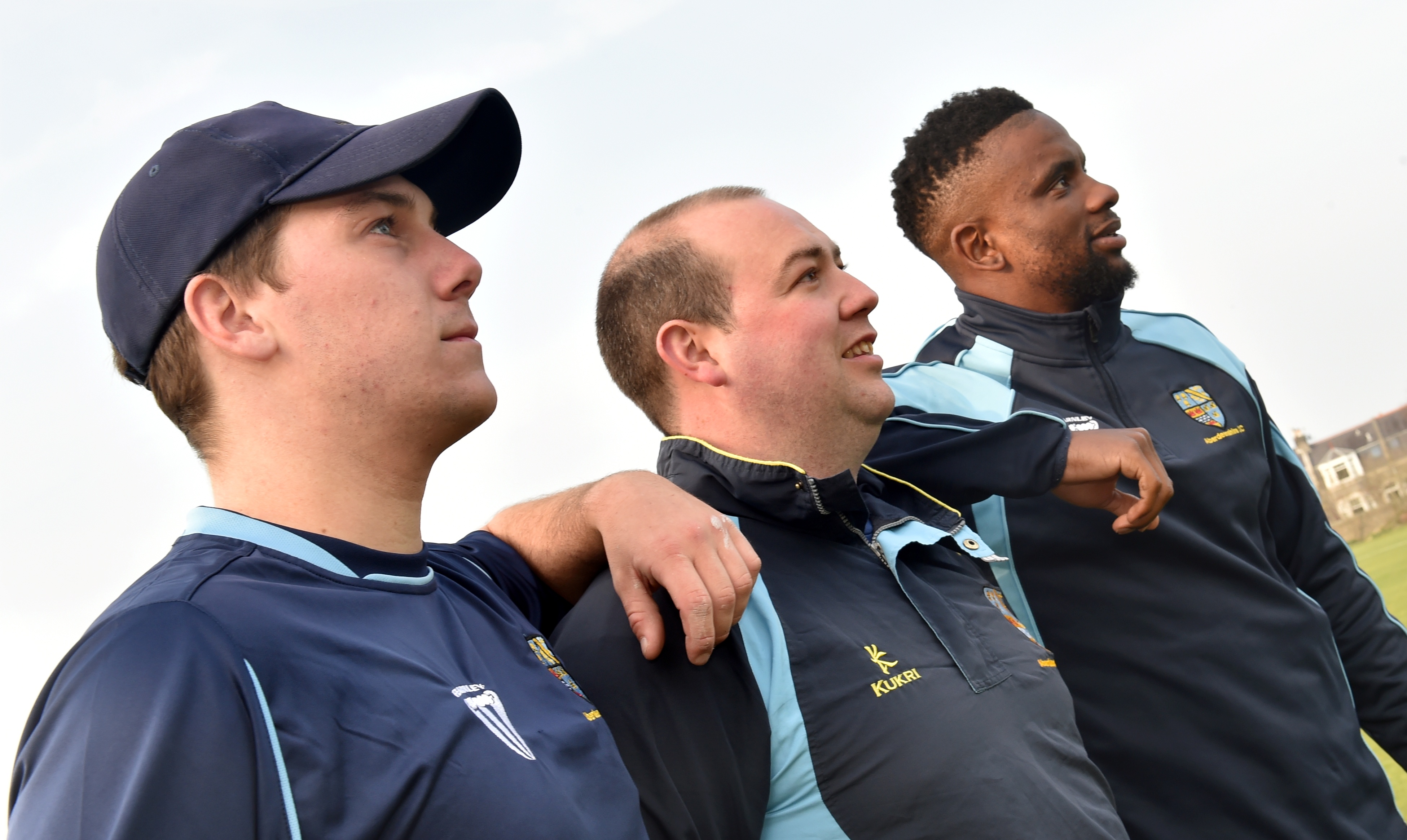 Kenny Reid (centre) with new professional Solo Nqweni (right) and returning amateur Callum Mackaness.