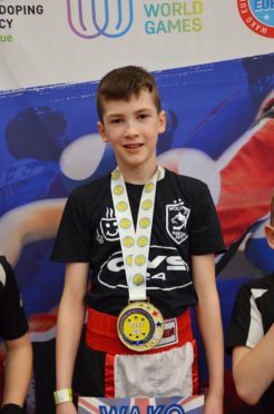 Aidan Lennan on the podium at the WAKO British Championships.