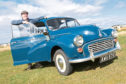 Darren Macrae from Embo with his 1969 Morris Minor 1000 in Trafalgar Blue photographed at Dornoch.
