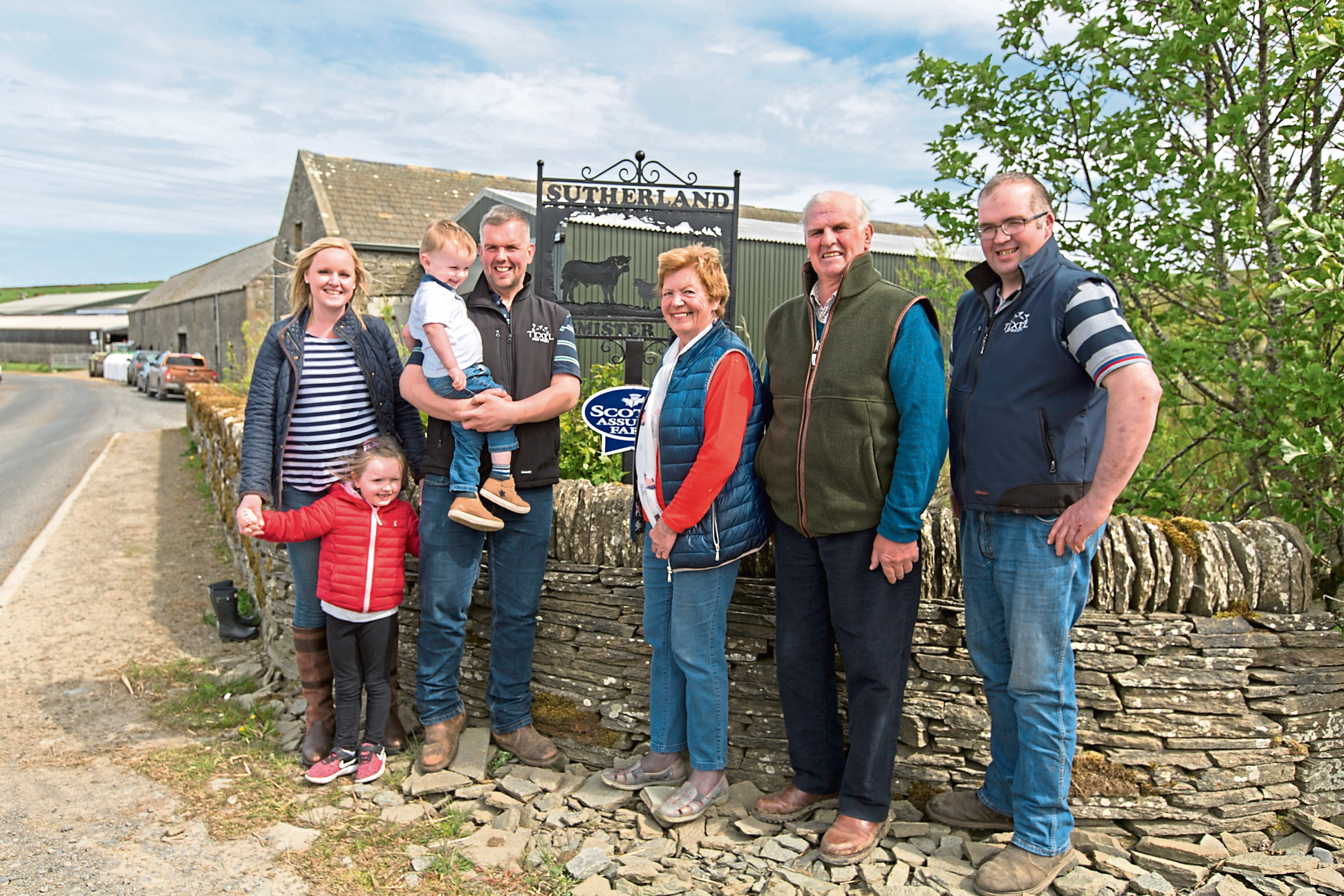 Kenneth Sutherland and wife Elspeth, are in the centre, son Stephen (right), son Kenneth to the left with his wife Fiona and children Jack and Amy.