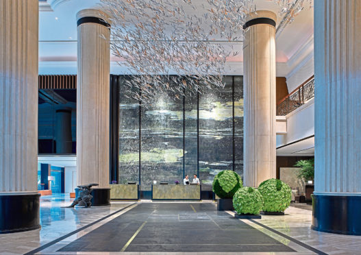 Shangri-la Singapore reception with tree canopy by Japanese designer Hirotoshi Sawada