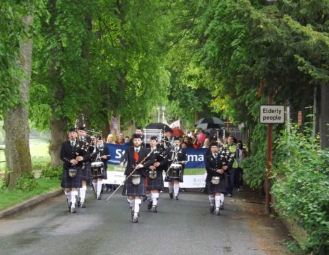 March to raise awareness of mental health issues was led by Northern Constabulary Community Pipe Band. credit Dave Conner