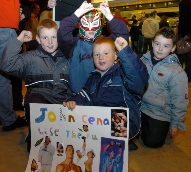 Daniel O'Gregor 10, Ryan Strachan 11, Shaun O'Gregor 7 and Kristian Howell 7, made signs to support their favourites in 2004