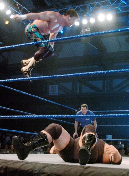 Eddie Guerrero almost hit the AECC roof as he leaped onto his fallen opponent, The Big Show