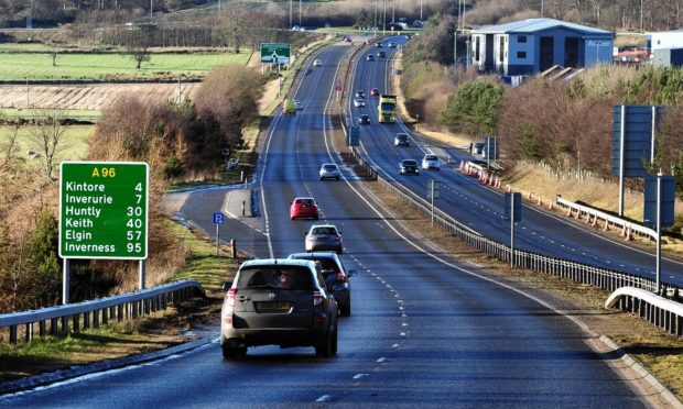 Cars drive along the A96 dual carriageway near Blackburn.