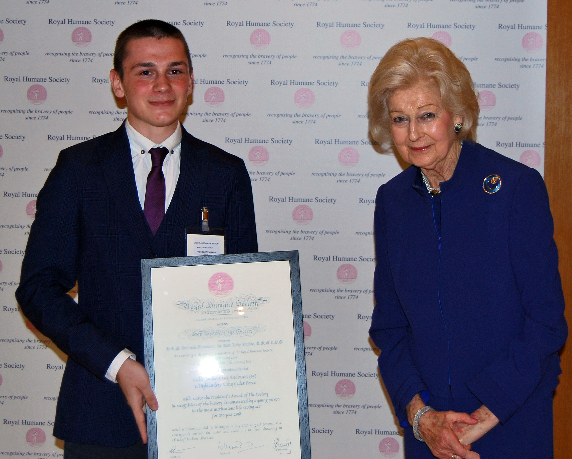 Jordan Anderson being presented with his award by Princess Alexandra.