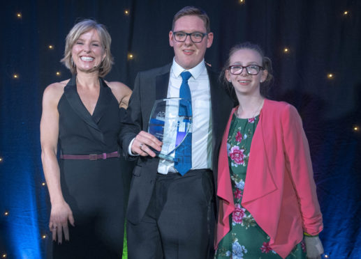 Greg Brands with Rona Dougall, left, the host of the awards, and Leeanne Clark, the award presenter.