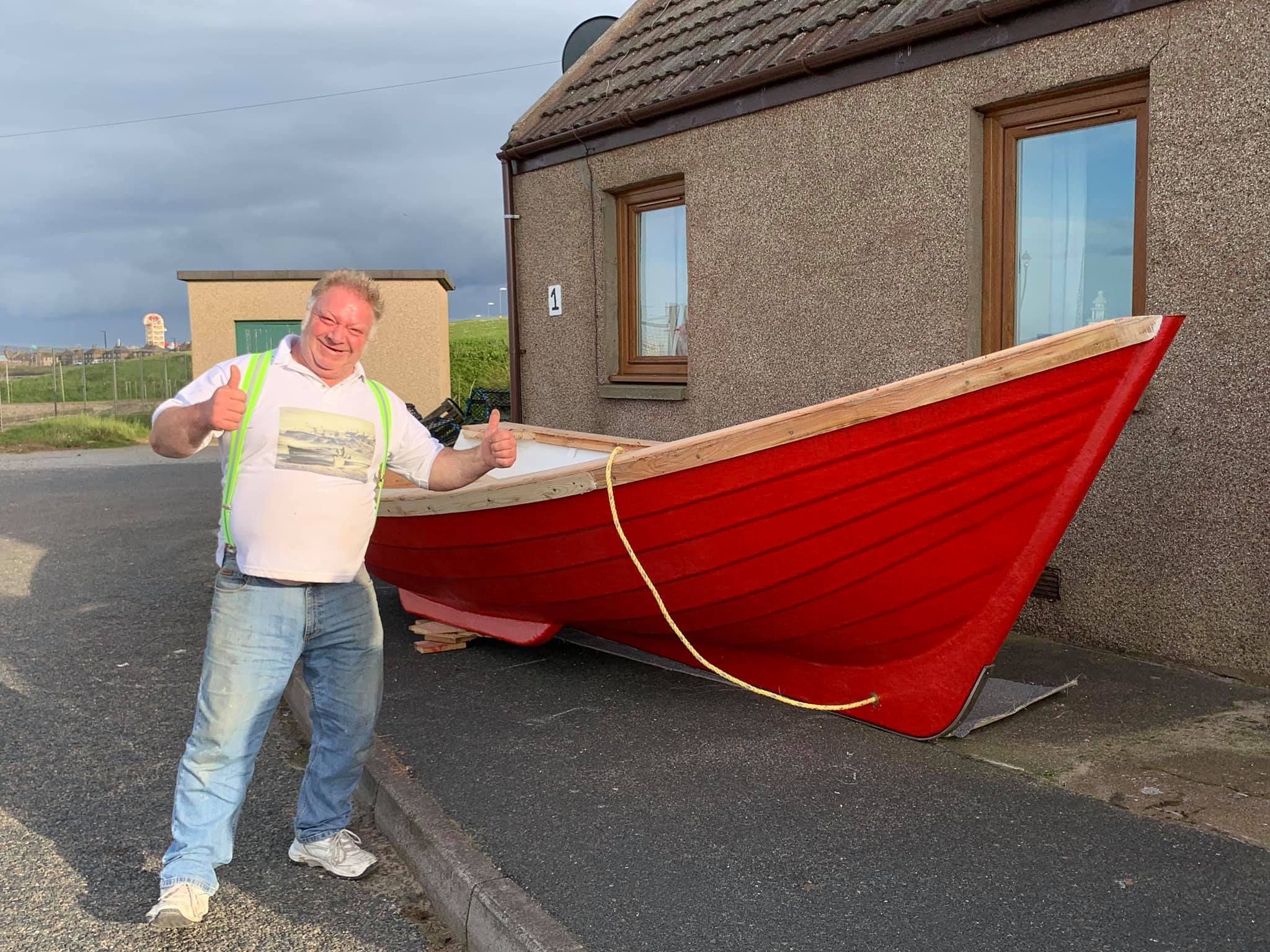 George Cameron with his boat