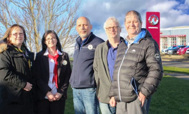 Buckie councillor Sonya Warren, Tesco employees Zoe Dallas and Richard Ross-Boyd, Moray Council's planning committee chairman David Bremner and Buckie councillor Gordon Cowie stand where the gateway installation will be put up.