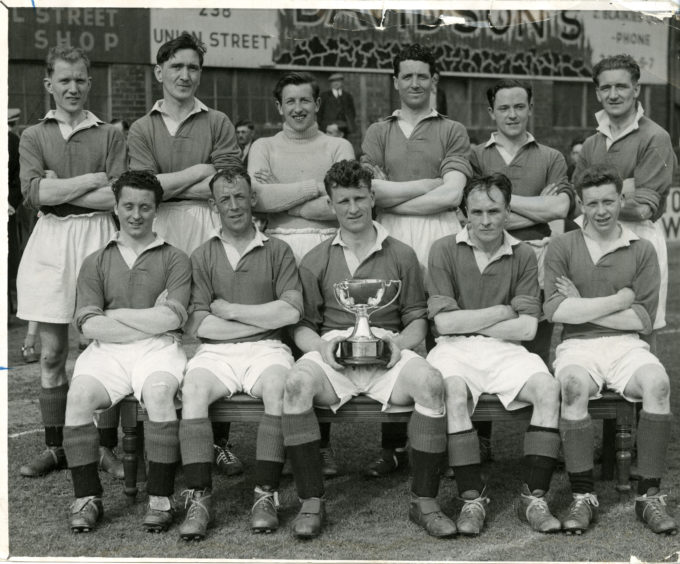 Cove Rangers, winners of the Aberdeen FC Trophy 1955-56. Back row: Doug Smith, Fred Barnett, Forsyth, Kenny Campbell, Ian Cameron, Taylor. Front row: Billy McGrath, John Massie, Jimmy Stuart, Henry Davis, Will." Picture taken 6 May 1956.