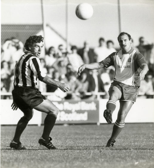 Jim Blacklaw gets the ball across for Cove, with Fraserburgh's Duncan looking on." Final score Cove Rangers 3 - Fraserburgh 1. Picture taken 11 August 1986.