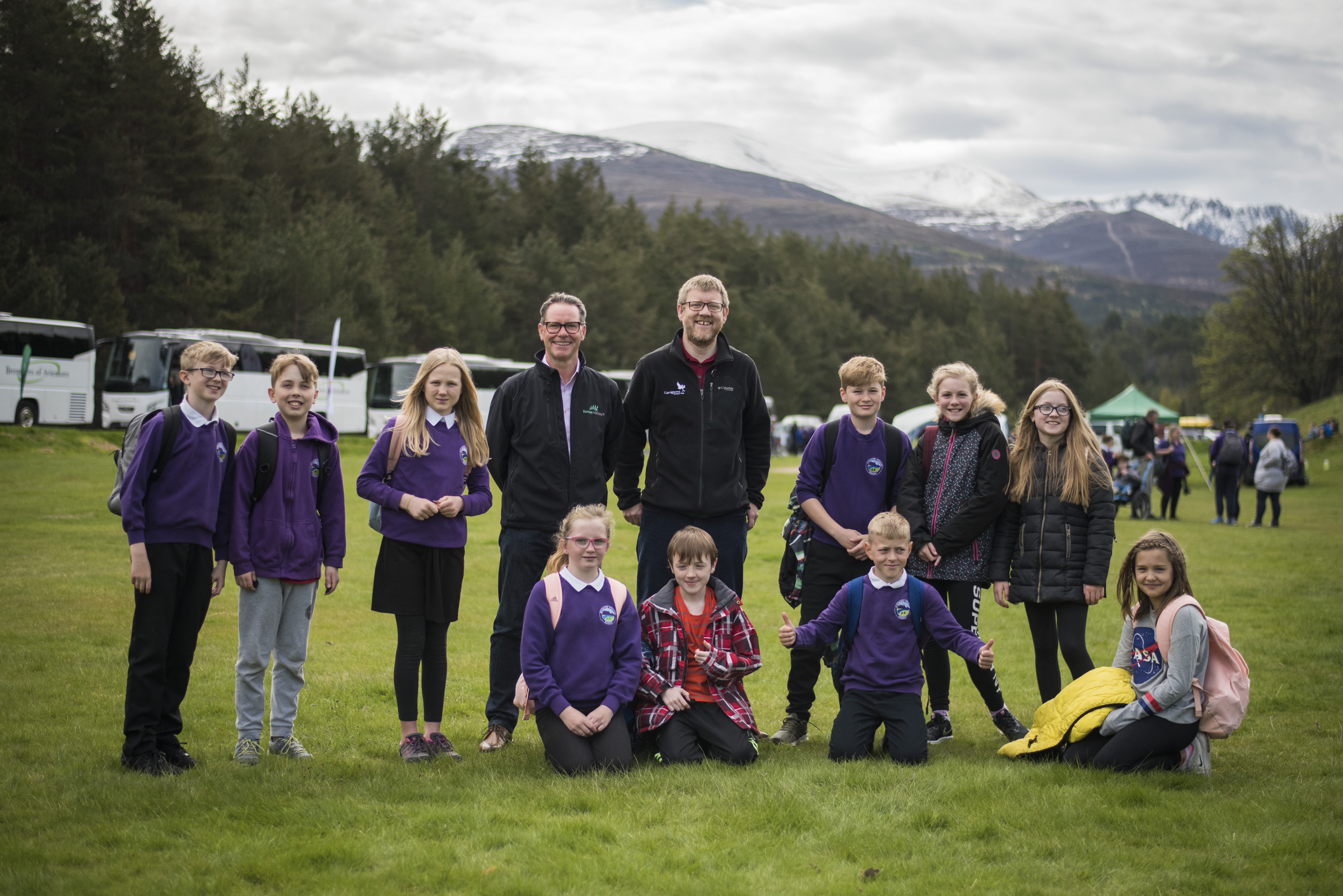 Bruce McKendrick, chief executive of Forest Holidays, and Grant Moir, chief executive of the CNPA, with pupils from Aviemore primary school yesterday at the Cairngorms Nature BIG Weekend