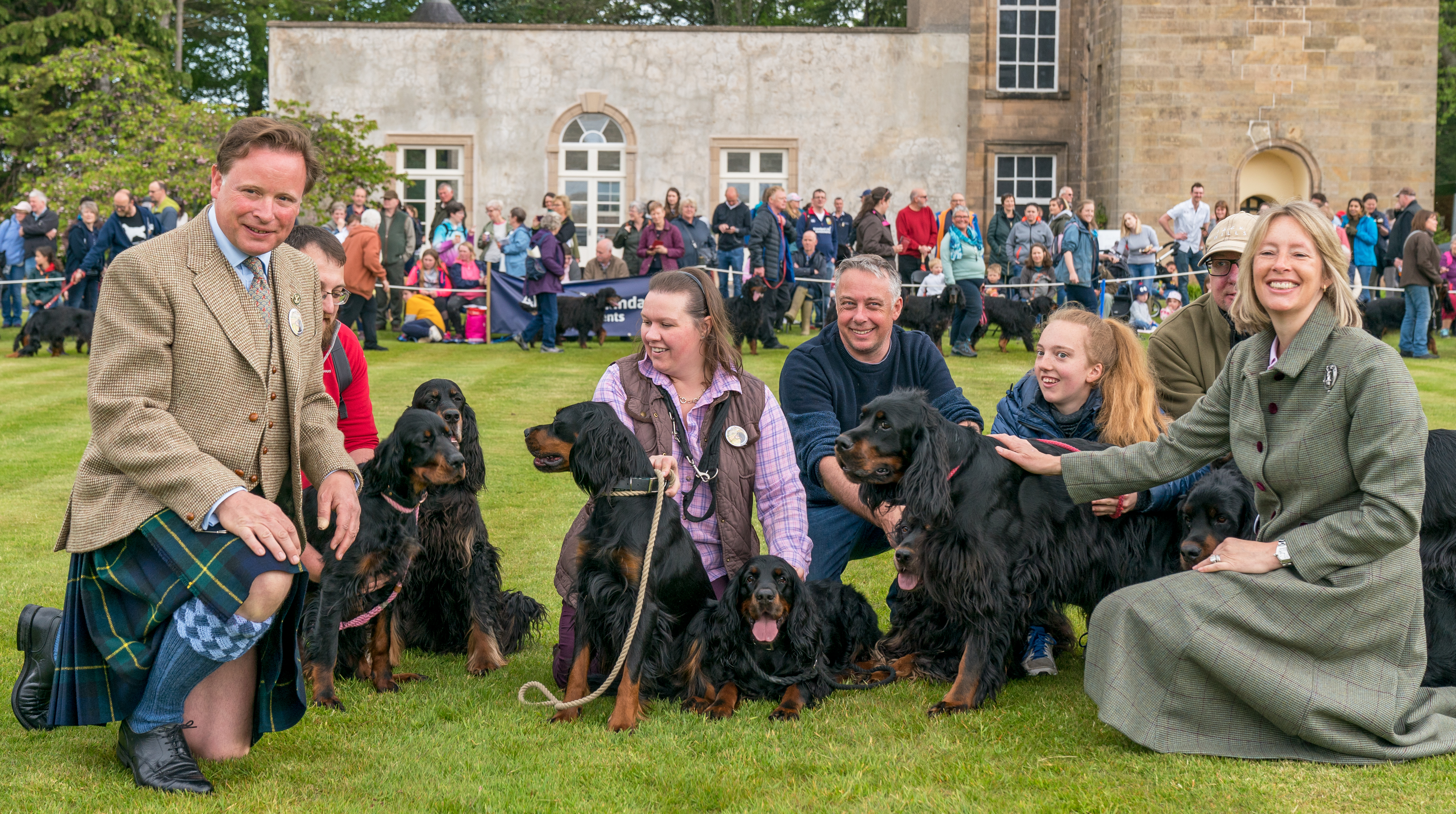 Angus and Zara Gordon Lennox with the assembly of Gordon Setters within their Castle Grounds.