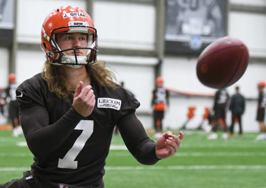 Punter Jamie Gillan #7 of the Cleveland Browns warms up on the sideline during a rookie mini camp. (Photo by: 2019 Diamond Images/Getty Images)