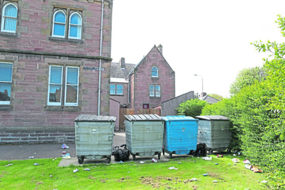 Items of litter which were scattered around on the ground near the bin area at Highland Council HQ in Inverness.