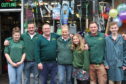 Kevin Milkins and his family outside the shop prior to its official opening in April 2010.