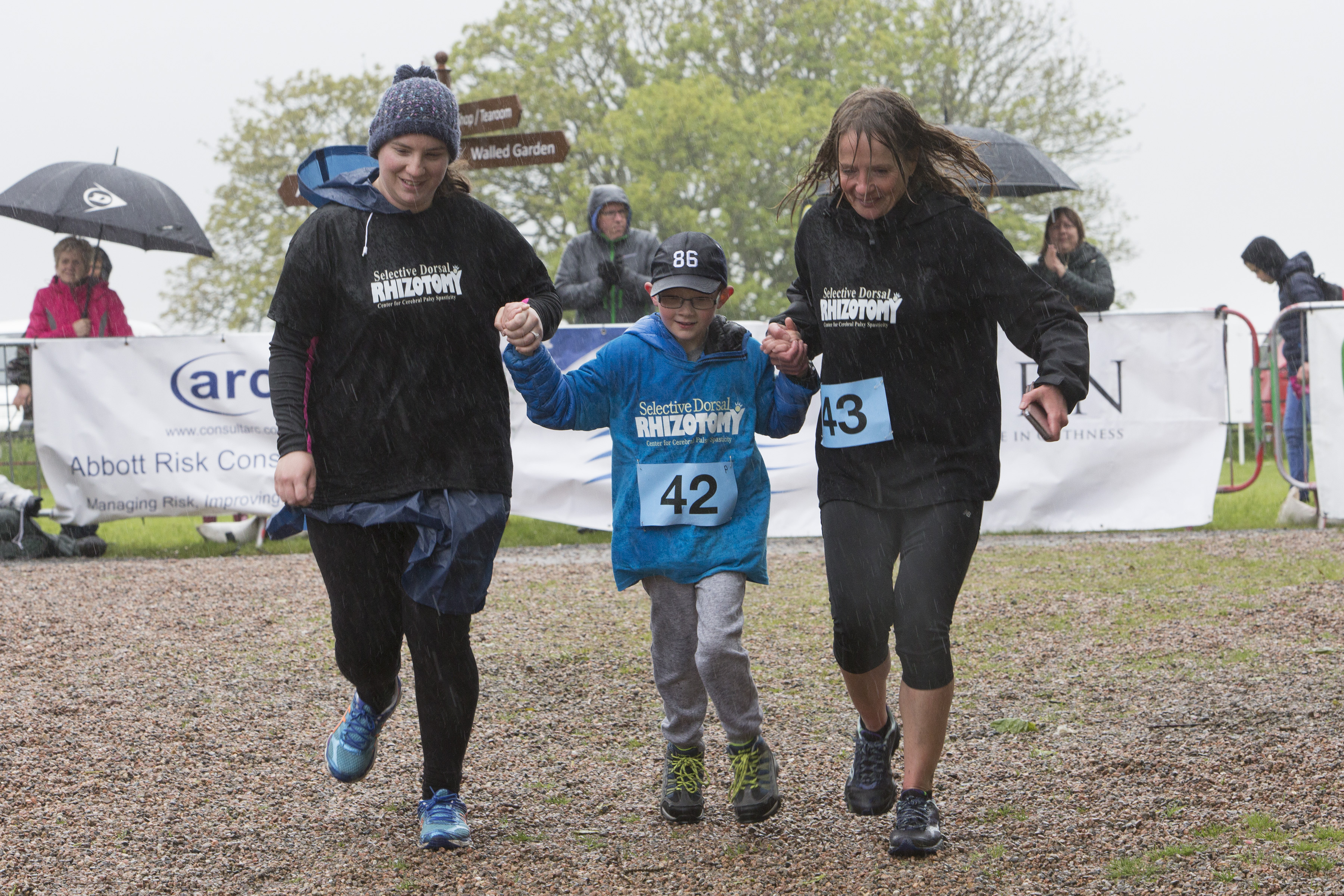 Kayden Malcolm with his mum Sarah, (left) and  local endurance athlete Lorna Stanger