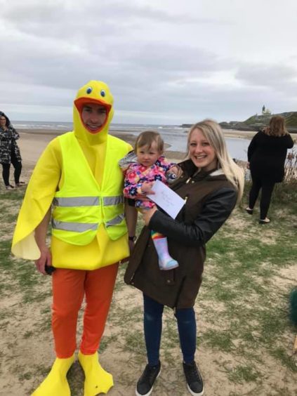 Lisa-Marie Gray with her daughter Lily and Alex Irvine dressed as Deveron Duck