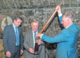 Kenneth Clarke MP uncasks the barrel of whisky that he filled on 13 May 1994. The barrel having been uncasked has whisky removed for tasting by MP Douglas Ross of Moray.