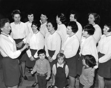 ON SONG: Mrs Netta Thom conducts the Young Wives' Group Choir of Kincorth South St Nicholas Church, Aberdeen, at a rehearsal in March 1973.