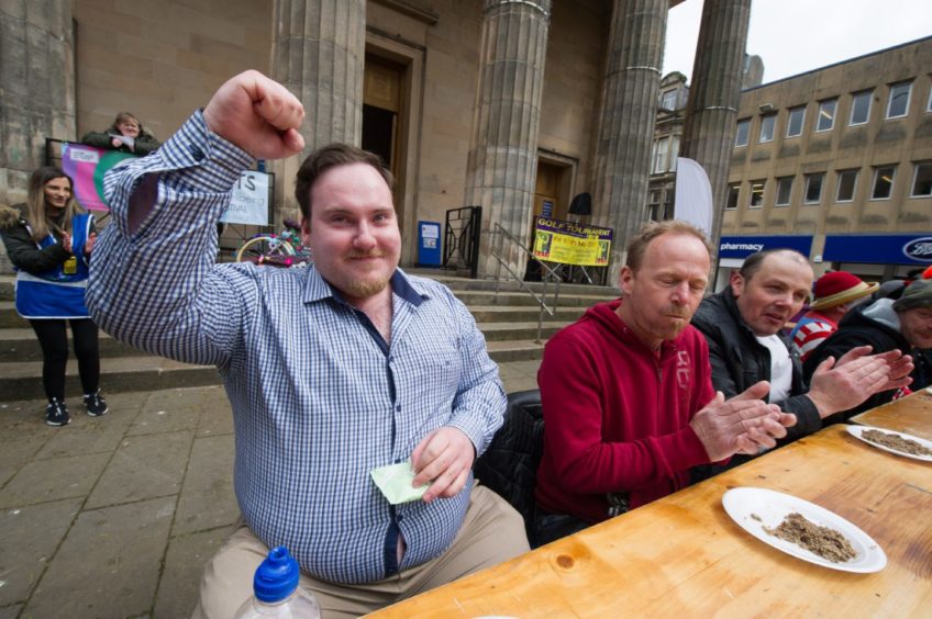 Jamie Harbour steals the Haggis eating competition and is declared winner!
