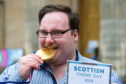 Picture by JASON HEDGES

Scottish Theme Day takes place in Elgin, with pipe bands and a haggis eating competition.

Picture: The Champ - Englishman, Jamie Harbour steals the Haggis eating competition and is declared winner!