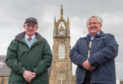 Ian Moir and Iain G Woods with the clock in Buckie. 
Picture by Jason Hedges