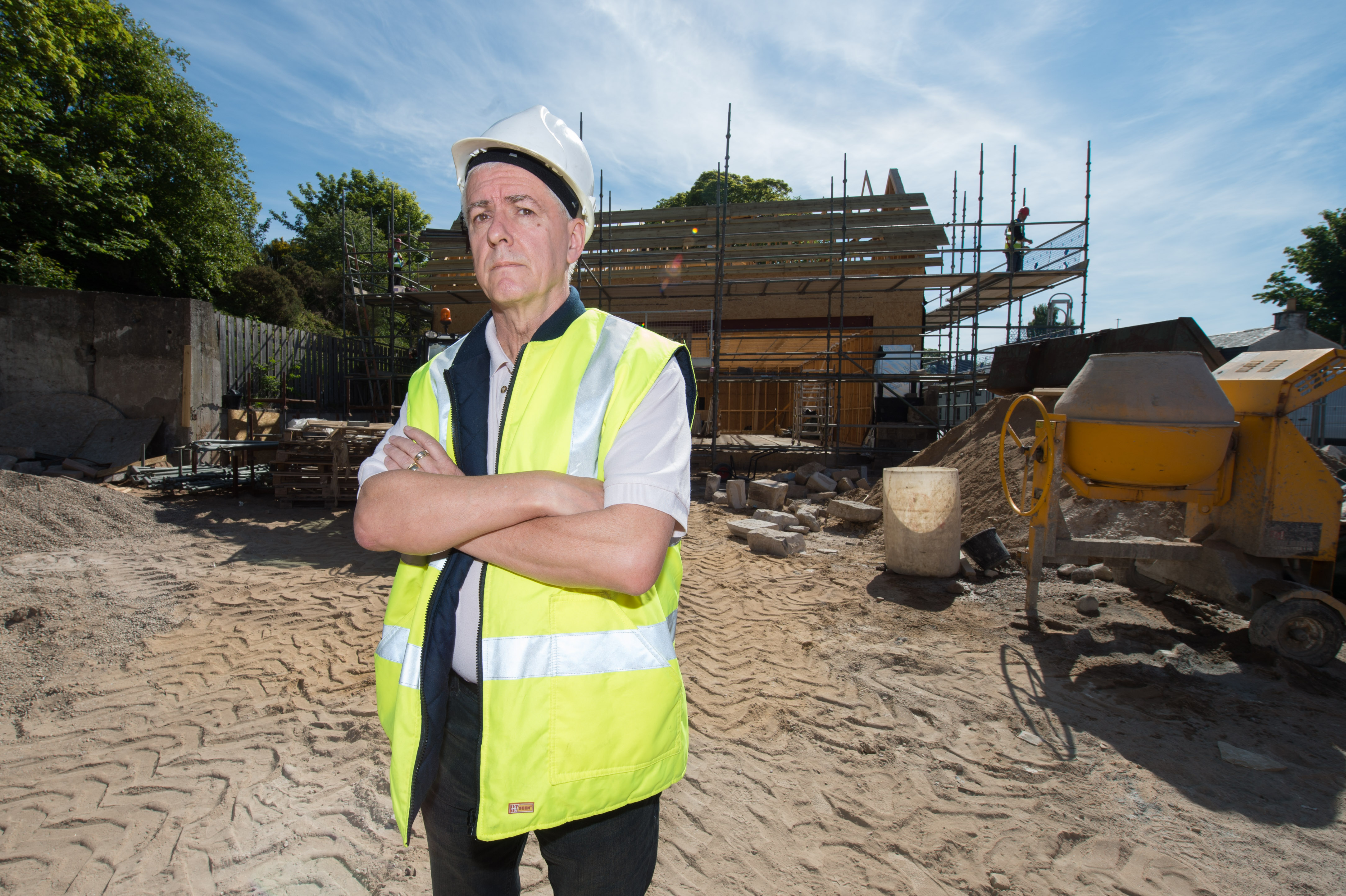 Picture by JASON HEDGES  

Picture shows Design Consultant Colin T. Keir at the construction site of the new Co-op on the high street in Lhanbryde.
