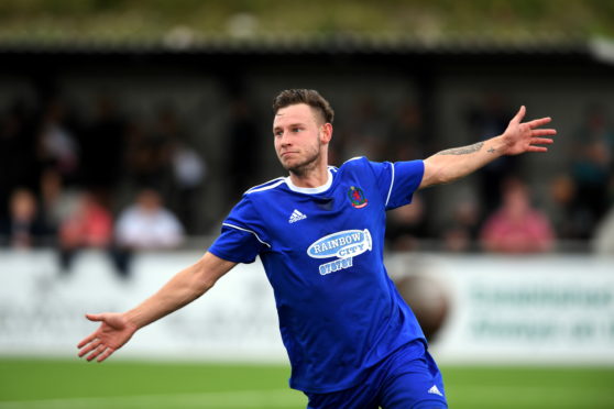 Cove's Mitch Megginson celebrating his second goal.     
Picture by Kami Thomson