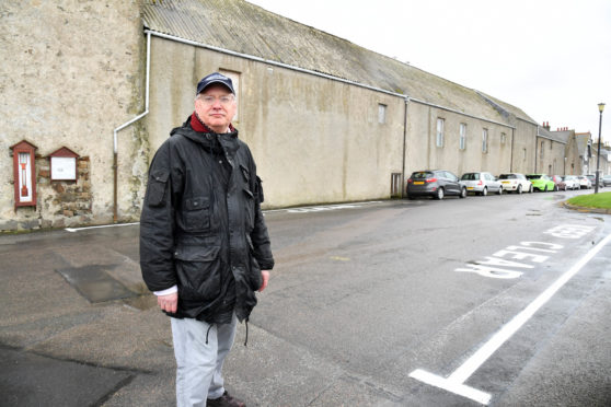 CLLR GLEN REYNOLDS AT BATTERY GREEN BANFF WHERE KEEP CLEAR SIGNS HAVE NOW BEEN PAINTED ON THE ROAD TO ENSURE THERE IS NO OBSTRUCTION TO EMERGENCY SERVICES ACCESSING THE COASTGUARD STATION.