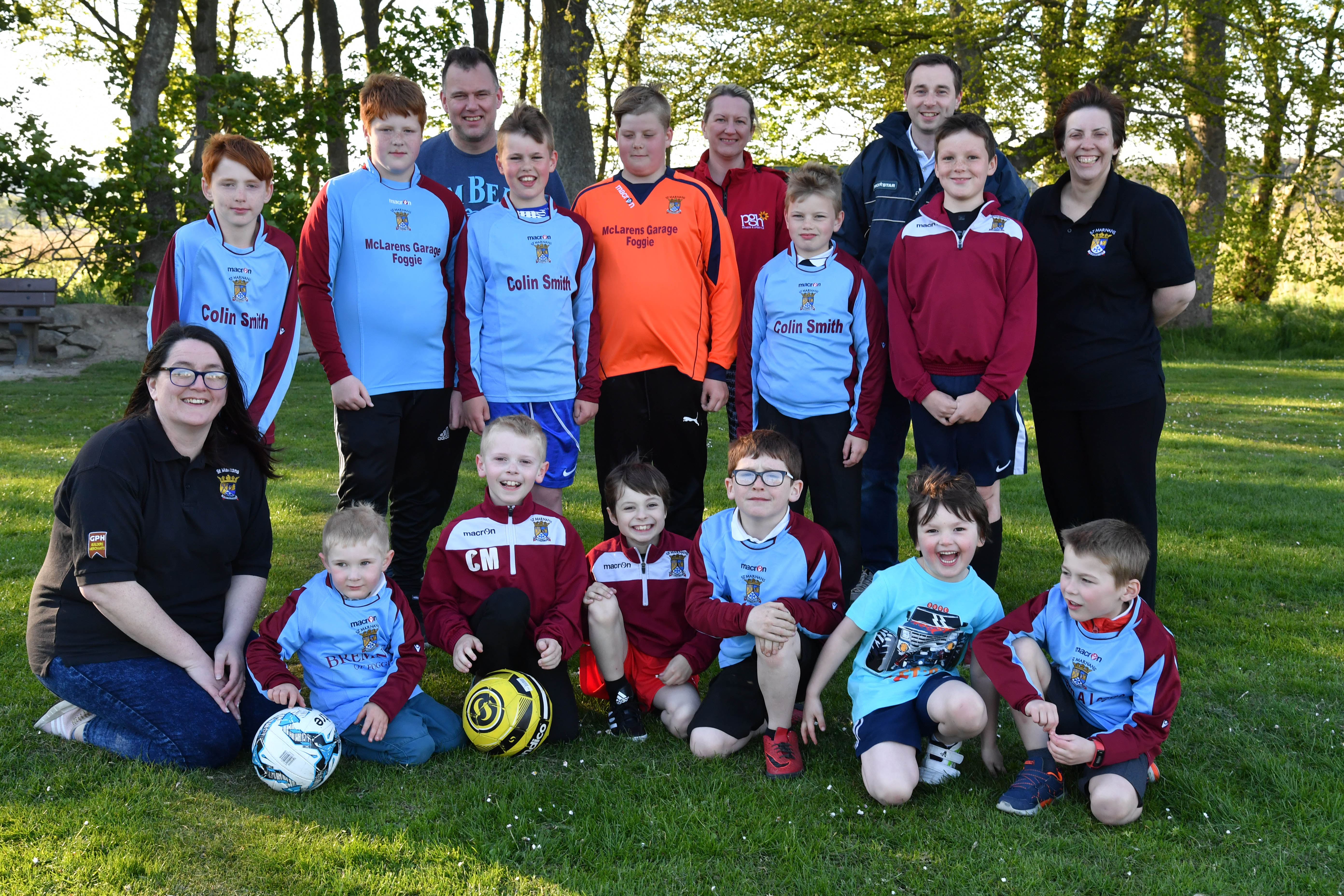 St Marnans sports club chairwoman Fiona Calder (l) with committee members and some of the youngsters who take part in the club's activities.