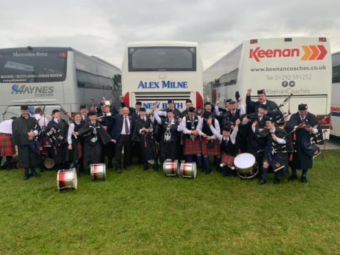 Members of the Turriff and district pipe band celebrate their success