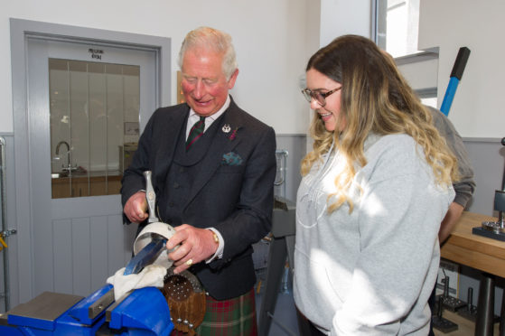 The Prince of Wales, known as the Duke of Rothesay while in Scotland, during a visit to Vanilla Ink in Banff, a Social Enterprise business that is bringing Silversmithing and Jewellery Making skills development opportunities to communities in Scotland. Photo: Jason Hedges/Press and Journal/PA Wire