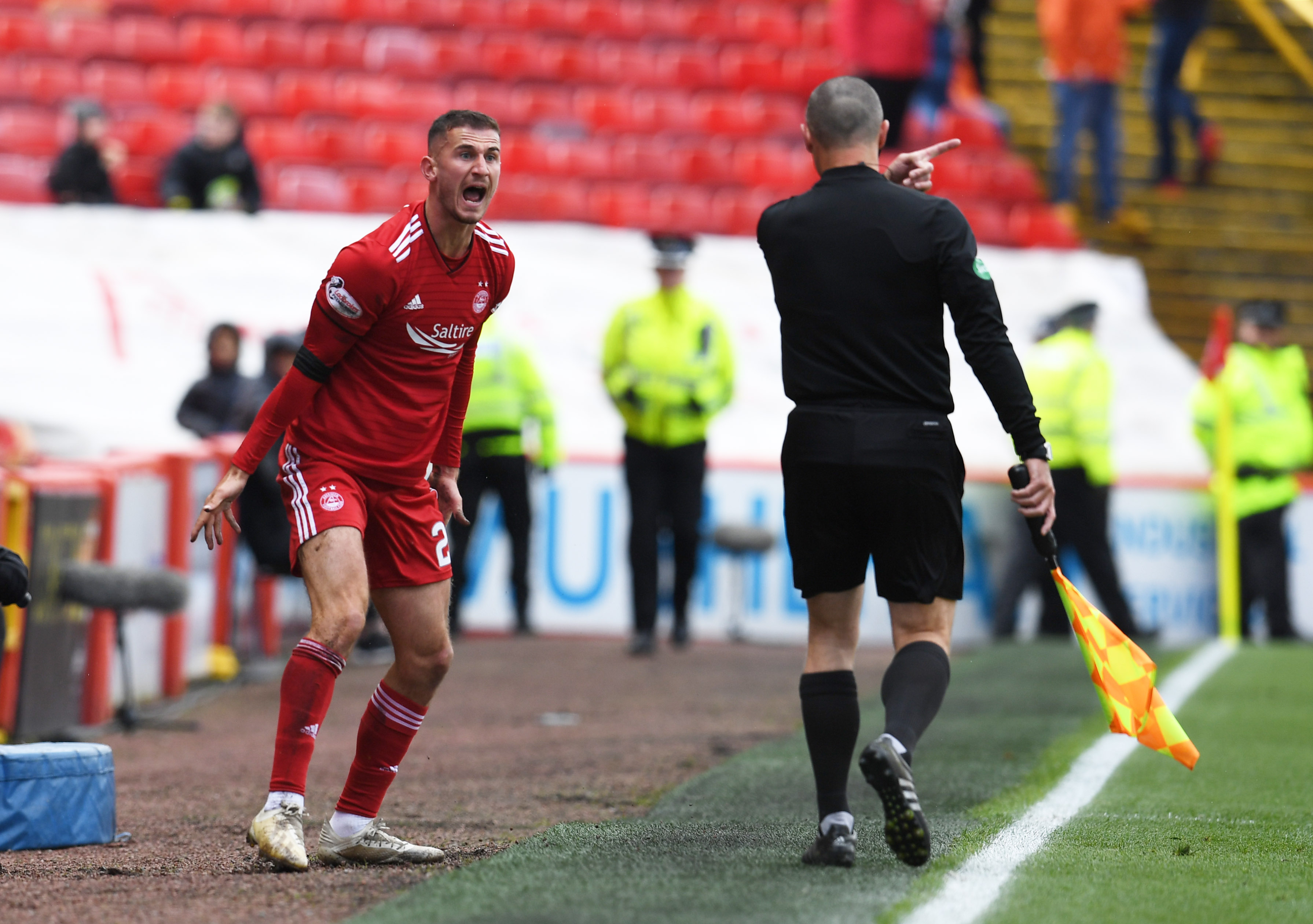 Aberdeen's Dom Ball berates the linesman.