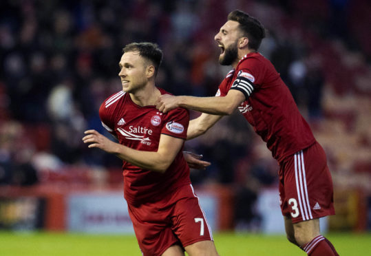 Greg Stewart is congratulated by Graeme Shinnie after his winner.